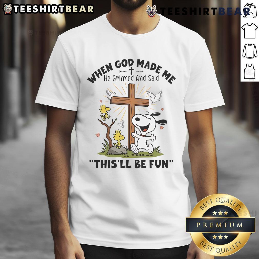 Alt Text: Cute Snoopy graphic on a t-shirt with the quote, When God Made Me He Grinned And Said This'll Be Fun.