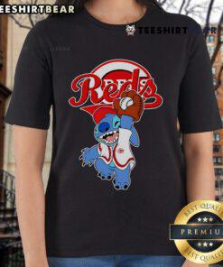 Cute Stitch playing baseball in a Cincinnati Reds ladies tee, showcasing team spirit and style for fans.