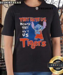 Cute Stitch Detroit Tigers ladies tee featuring 'They Hate Us Because They Ain't Us' slogan in vibrant colors.