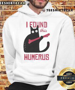 Alt Text: Humorous cat wearing a bone hoodie, showcasing its playful personality in a fun and quirky setting.