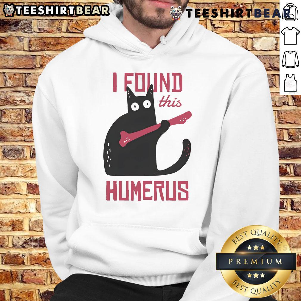Alt Text: Humorous cat wearing a bone hoodie, showcasing its playful personality in a fun and quirky setting.