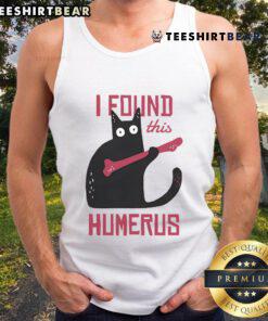 Funny cat wearing a bone tank top, showcasing its humorous side and playful personality. Perfect for cat lovers!