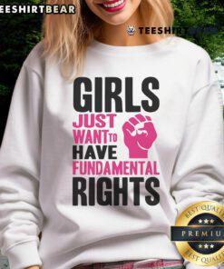 Funny girl wearing 'Just Want to Have Fundamental Rights' sweatshirt at a lively protest for women's rights.