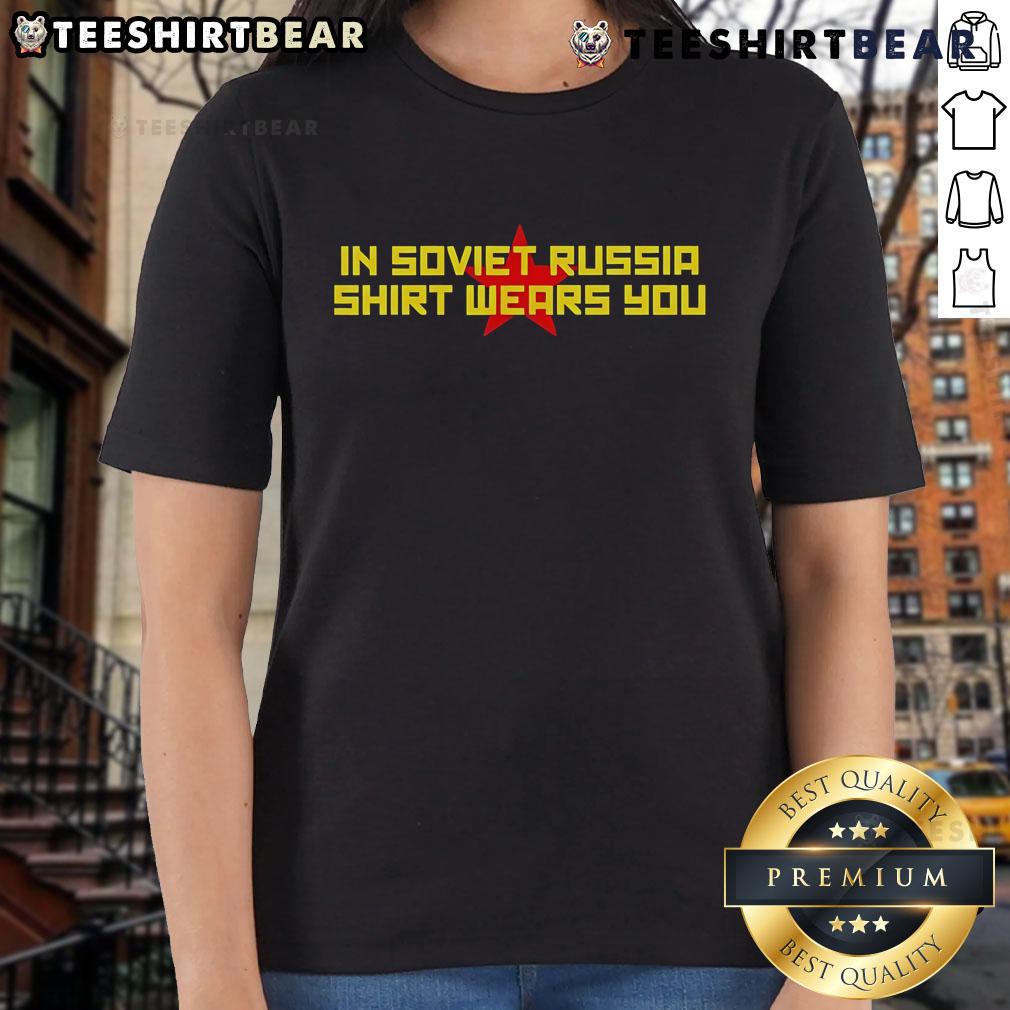 Funny 'In Soviet Russia, Shirt Wears You' Ladies Tee displayed on a model, showcasing humor and unique style.