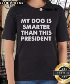 Funny ladies tee featuring a playful dog graphic with the caption 'My Dog Is Smarter Than The President'.