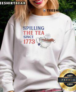 Funny 'Spilling The Tea Since 1773' sweatshirt featuring a humorous design perfect for tea lovers and history buffs.