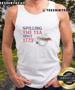 Funny 'Spilling the Tea Since 1773' tank top design featuring a playful teacup graphic and stylish typography.