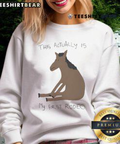 Funny 'This Actually Is My First Rodeo' horse sweatshirt featuring a playful design for rodeo enthusiasts.