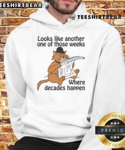Good Looks Like Another One Of Those Weeks Where Decades Happen Hoodie displayed on a hanger in a stylish setting.