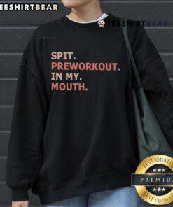Person wearing a Nice Spit Preworkout sweatshirt, showcasing fitness enthusiasm and style during workout preparation.