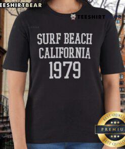 1979 California surf beach scene featuring ladies in stylish tees enjoying the sun and waves.