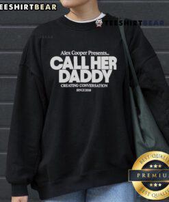Official Alex Cooper Call Her Daddy sweatshirt showcasing 'Creating Conversation Since 2018' slogan in stylish design.