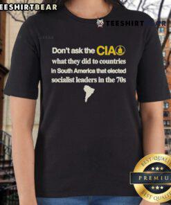 Official 'Don't Ask The CIA' Ladies Tee featuring bold text on the impact of CIA actions in South Americas socialist countries.