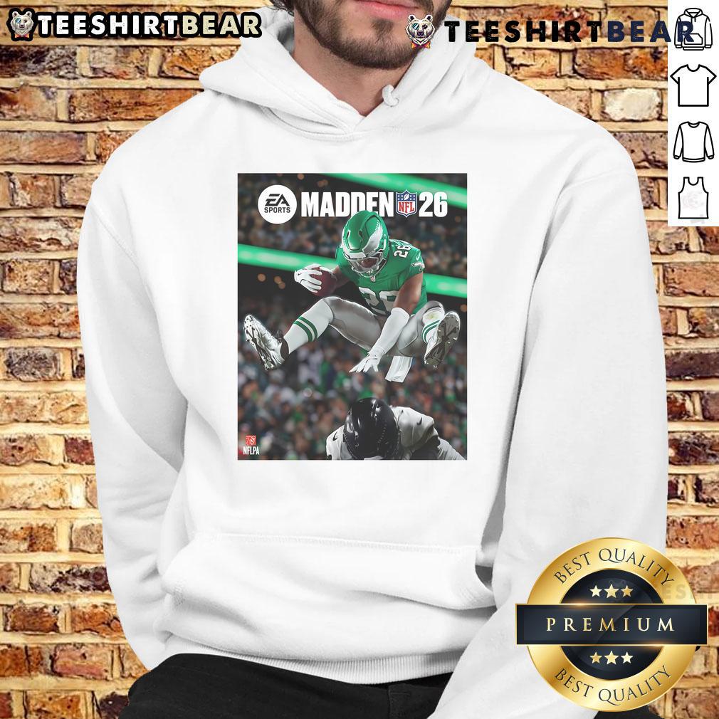 Saquon Barkley hurdles a defender on the cover of Madden NFL, featured on a stylish Philadelphia Eagles hoodie.