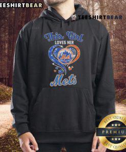Girl proudly wearing her New York Mets hoodie, showcasing her love for the team in a vibrant outdoor setting.