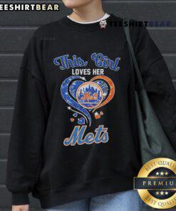 Alt Text: Woman wearing an Official New York Mets sweatshirt, showcasing her love for the team in vibrant colors.