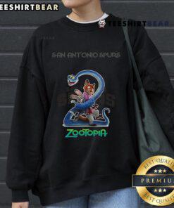 Alt Text: Premium San Antonio Spurs Zootopia 2 Sweatshirt featuring vibrant graphics and comfortable fit for fans.