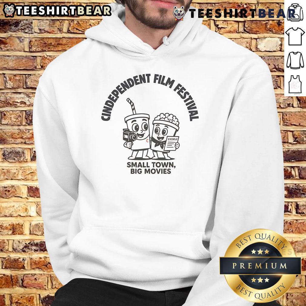 Cozy Pretty-Cindependent Small Town Big Movies hoodie displayed on a rustic wooden background, perfect for film lovers.