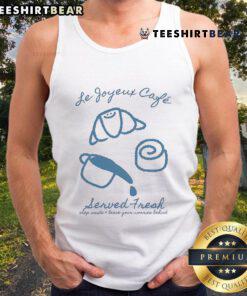 Model wearing a 'Pretty Le Joyeux Cafe' tank top, inviting you to step inside and leave your worries behind.