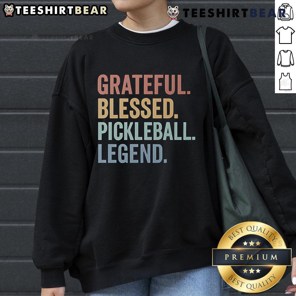 Cozy 'Top Grateful Blessed Pickleball Legend' sweatshirt in vibrant colors, perfect for pickleball enthusiasts and fans.
