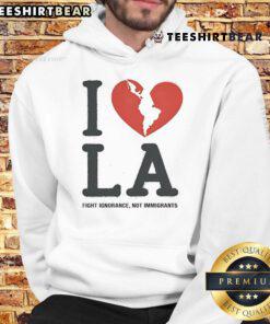 Alt Text: Top I Heart Broken LA Fight Ignorance Not Immigrants hoodie showcasing a bold design promoting immigrant rights.