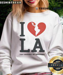 Top I Heart Broken LA Fight Ignorance Not Immigrants sweatshirt showcasing a bold message on social justice and inclusivity.