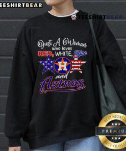 Woman wearing a red, white, and blue Houston Astros sweatshirt, showcasing her team spirit and love for baseball.