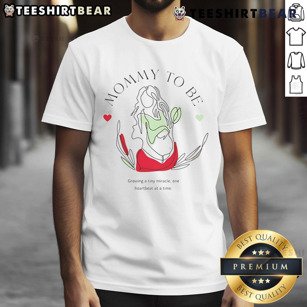 Alt Text: Top Mommy To Be Growing A Tiny Miracle T-Shirt featuring a cute baby bump design for expectant mothers.