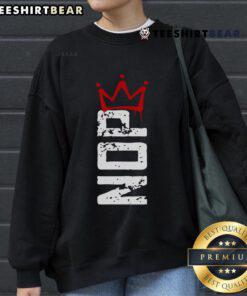 Top No Kings protest sign on a vertical sweatshirt, showcasing powerful activism and bold message against monarchy.