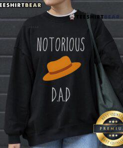 Trendy Top No-Torious Dad Hat Sweatshirt displayed on a mannequin, perfect for casual wear and stylish outfits.