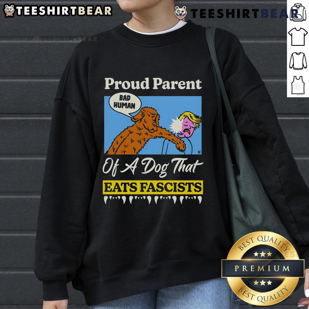 Top Proud Parent of a Dog That Eats Fascists sweatshirt featuring bold text and a playful design, perfect for dog lovers.