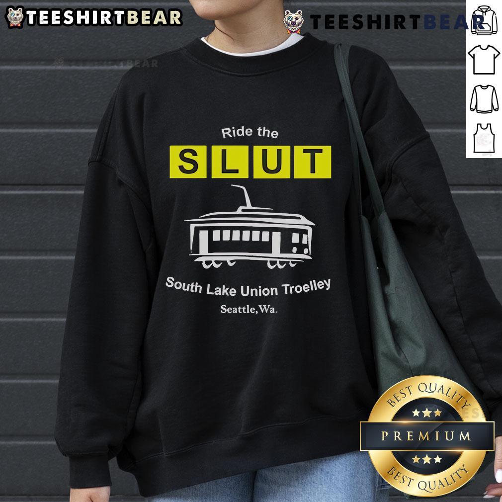 Cozy sweatshirt featuring 'Top Ride the SLUT' design, perfect for fans of the South Lake Union Trolley in Seattle, WA.