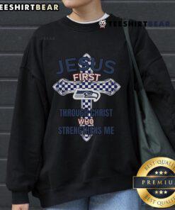 Alt Text: Top Seattle Seahawks sweatshirt featuring 'Jesus First' and 'Through Christ Who Strengthens Me' design.