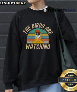 Top The Birds Are Watching Wake Up America sweatshirt featuring a vibrant design and comfortable fit for casual wear.