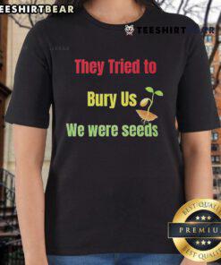 Top They Tried To Bury Us We Were Seeds Ladies Tee in vibrant color, showcasing an empowering message for women.