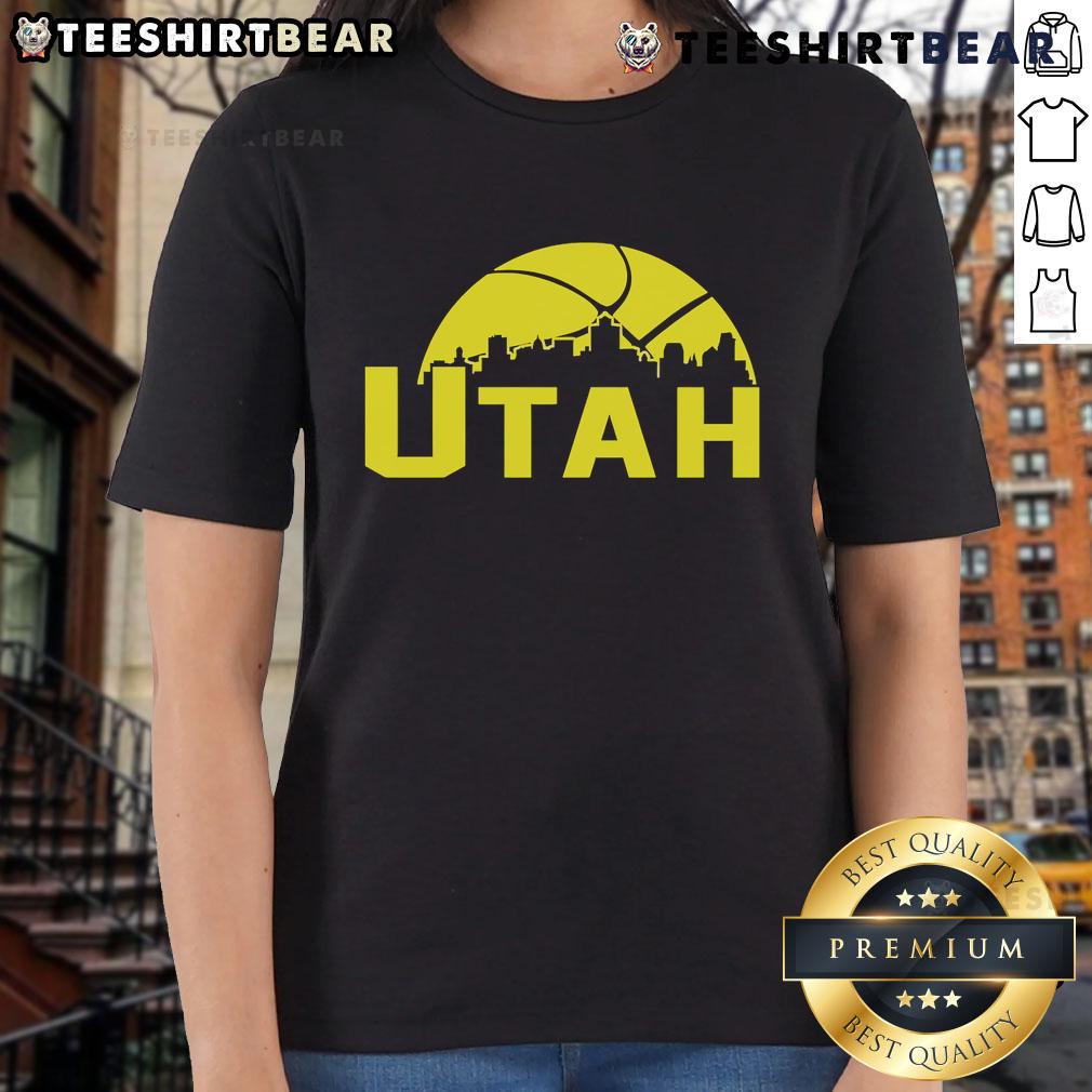 Stylish 2025 Ladies Tee featuring the vibrant skyline of Utah Jazz cityscape, perfect for fans and fashion lovers.