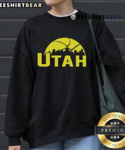Stylish 2025 Utah Jazz cityscape skyline sweatshirt featuring vibrant colors and team logo, perfect for fans.