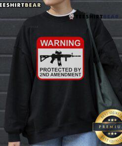 Top Warning Protected by 2nd Amendment Sweatshirt featuring bold text on a cozy, stylish design for gun rights supporters.