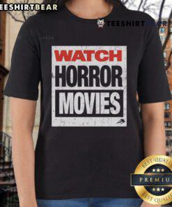 Stylish ladies tee featuring a graphic design of top watch horror movies, perfect for horror film enthusiasts.