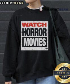 Top Watch Horror Movies Sweatshirt featuring spooky graphics and cozy design for horror film enthusiasts.