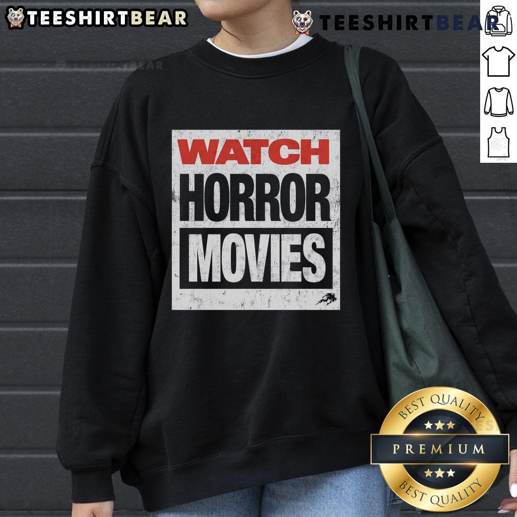 Top Watch Horror Movies Sweatshirt featuring spooky graphics and cozy design for horror film enthusiasts.