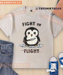 Adorable penguin graphic on a washed t-shirt, perfect for casual wear. Cute fight or flight theme for animal lovers.