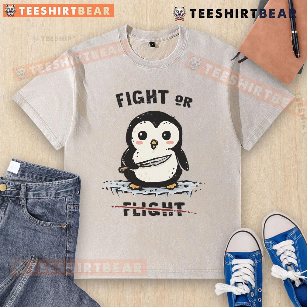Adorable penguin graphic on a washed t-shirt, perfect for casual wear. Cute fight or flight theme for animal lovers.