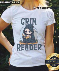 Alt Text: Cute Grim Reader wearing a ladies tee, engrossed in reading a book, showcasing a whimsical literary vibe.