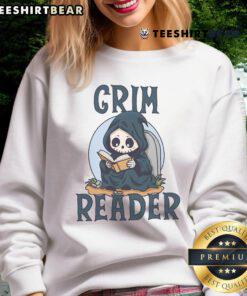 Cute Grim Reader wearing a cozy sweatshirt while reading a book, perfect for book lovers and cozy vibes.