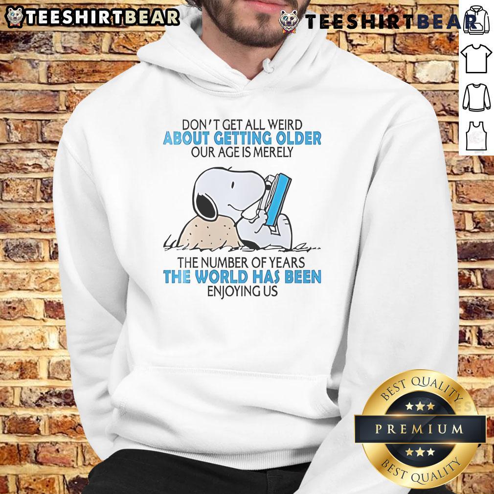 Cute Snoopy hoodie with text 'Don't Get All Weird About Getting Older' celebrating age with style and humor.