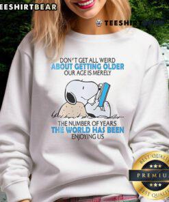 Alt Text: Cute Snoopy sweatshirt with 'Don't get all weird about getting older' message, perfect for casual wear.