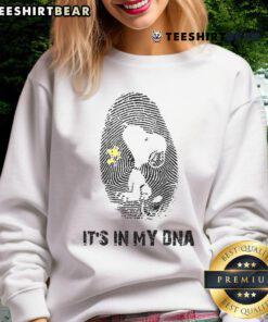 Alt Text: Cute Snoopy sweatshirt featuring 'It's in my DNA' design, perfect for fans of Peanuts and cozy fashion.