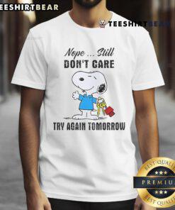 Adorable 'Cute Snoopy Nope Still Don't Care Try Again Tomorrow' T-Shirt featuring Snoopy in a fun, relaxed design.