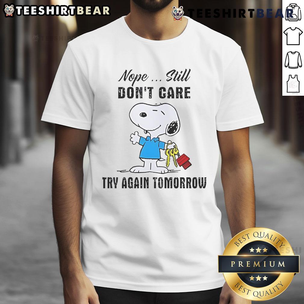 Adorable 'Cute Snoopy Nope Still Don't Care Try Again Tomorrow' T-Shirt featuring Snoopy in a fun, relaxed design.
